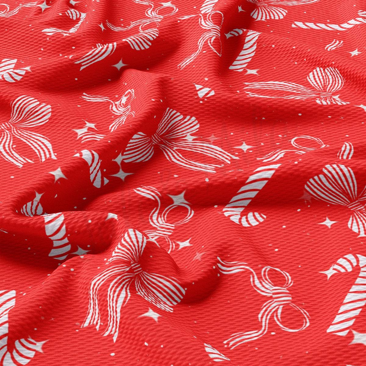 a red fabric with white stars and candy canes