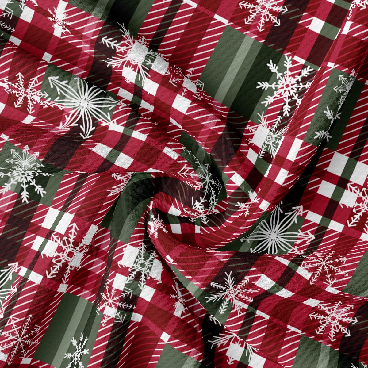 a red and green plaid fabric with snowflakes on it