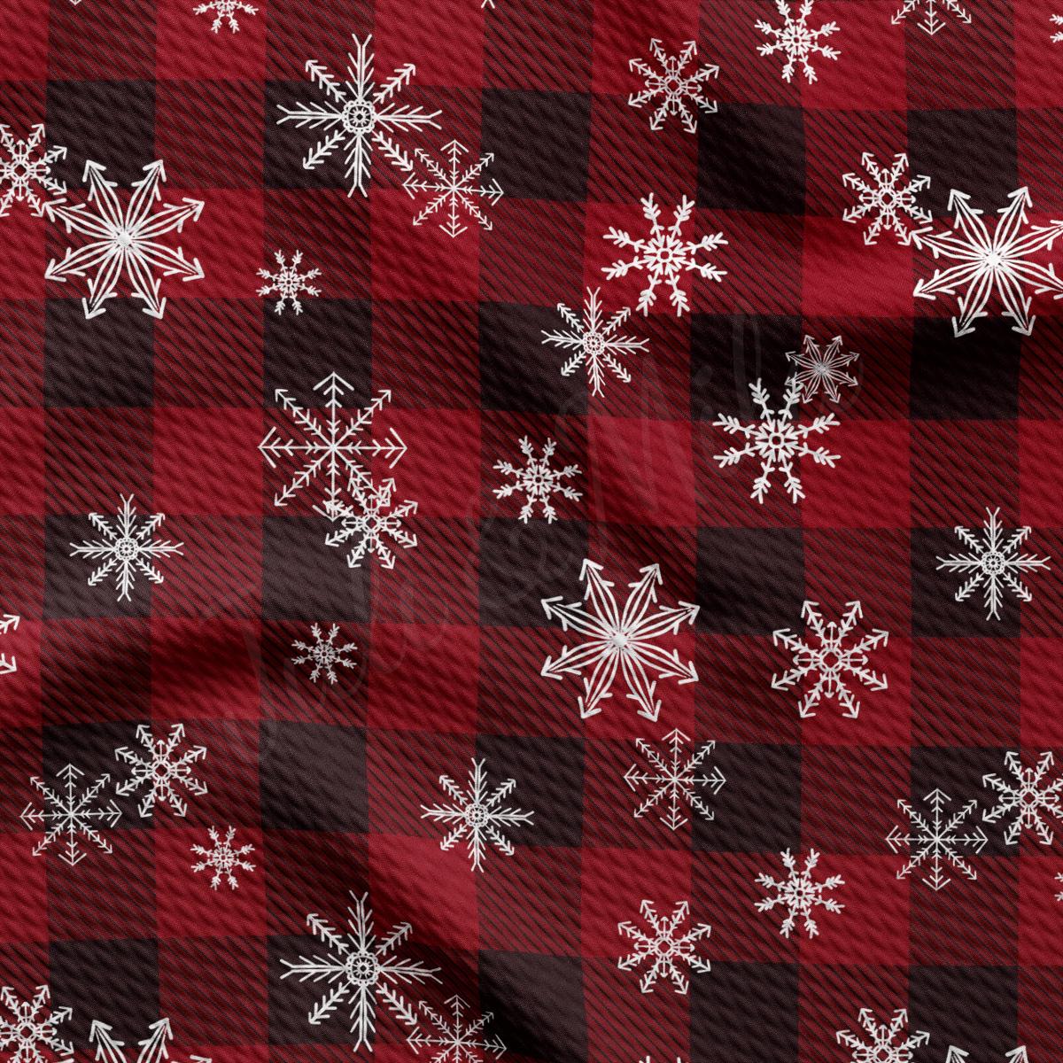 a red and black checkered pattern with white snowflakes