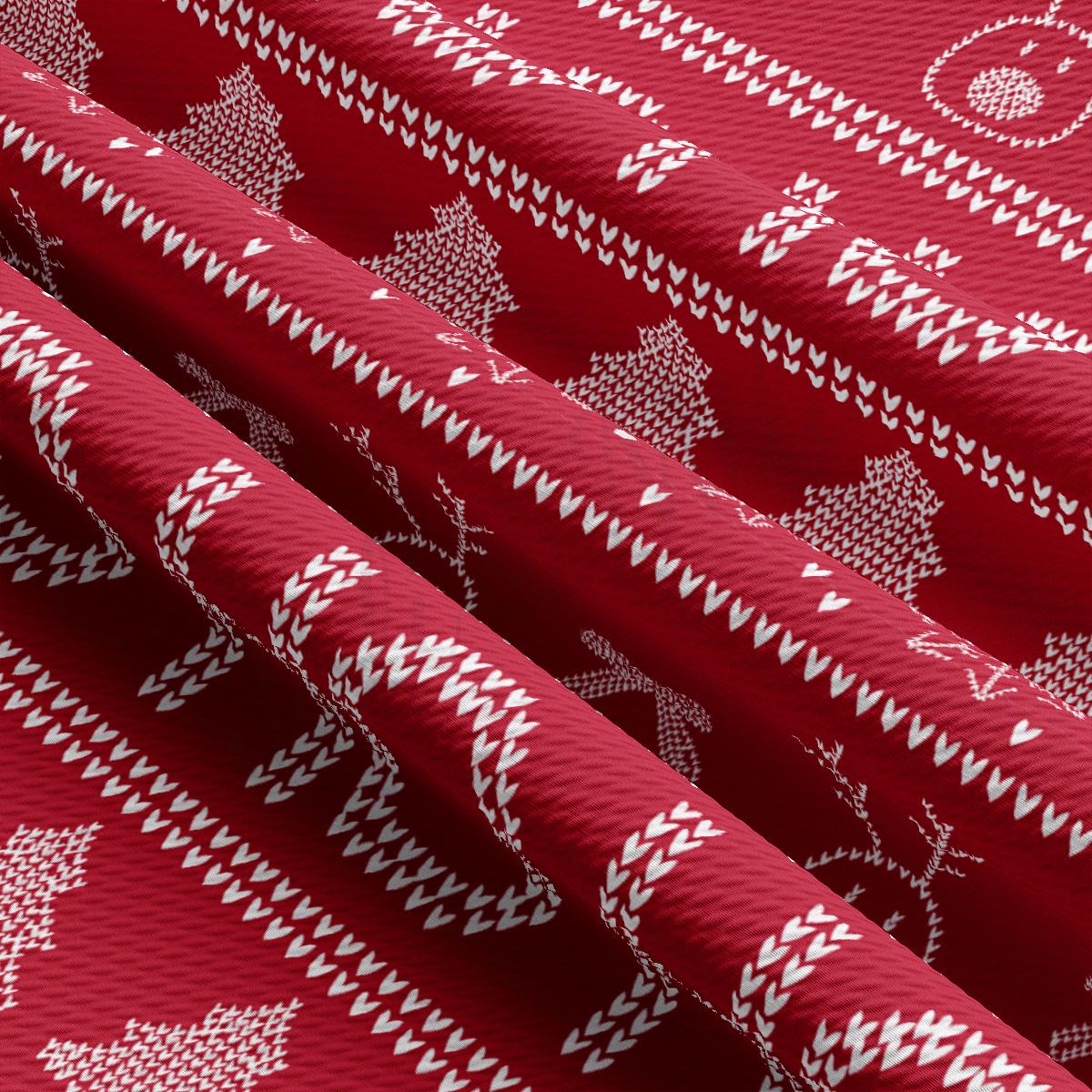 a close up of a red fabric with white designs