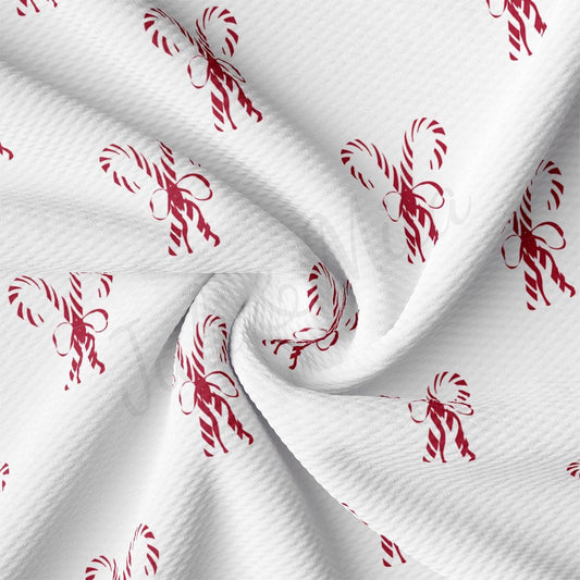 a white fabric with red designs on it