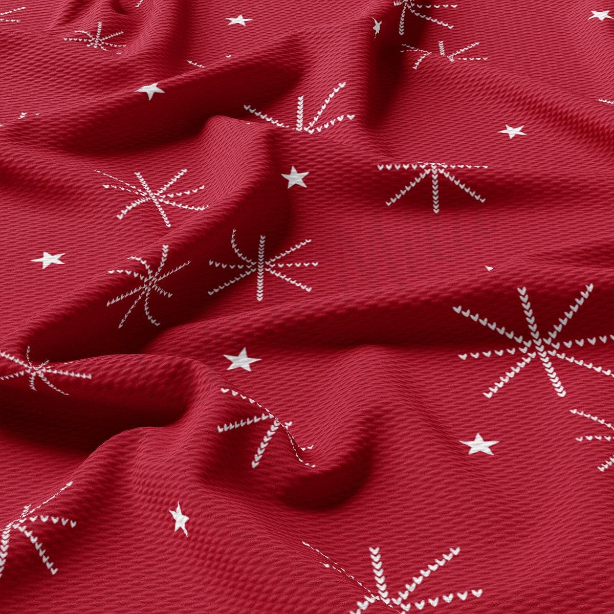 a red fabric with white stars on it