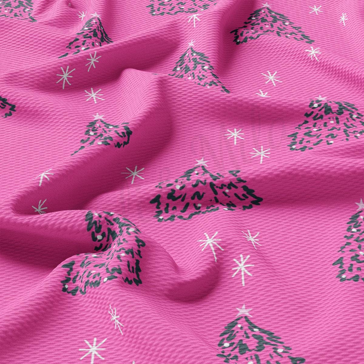 a close up of a pink fabric with snowflakes on it