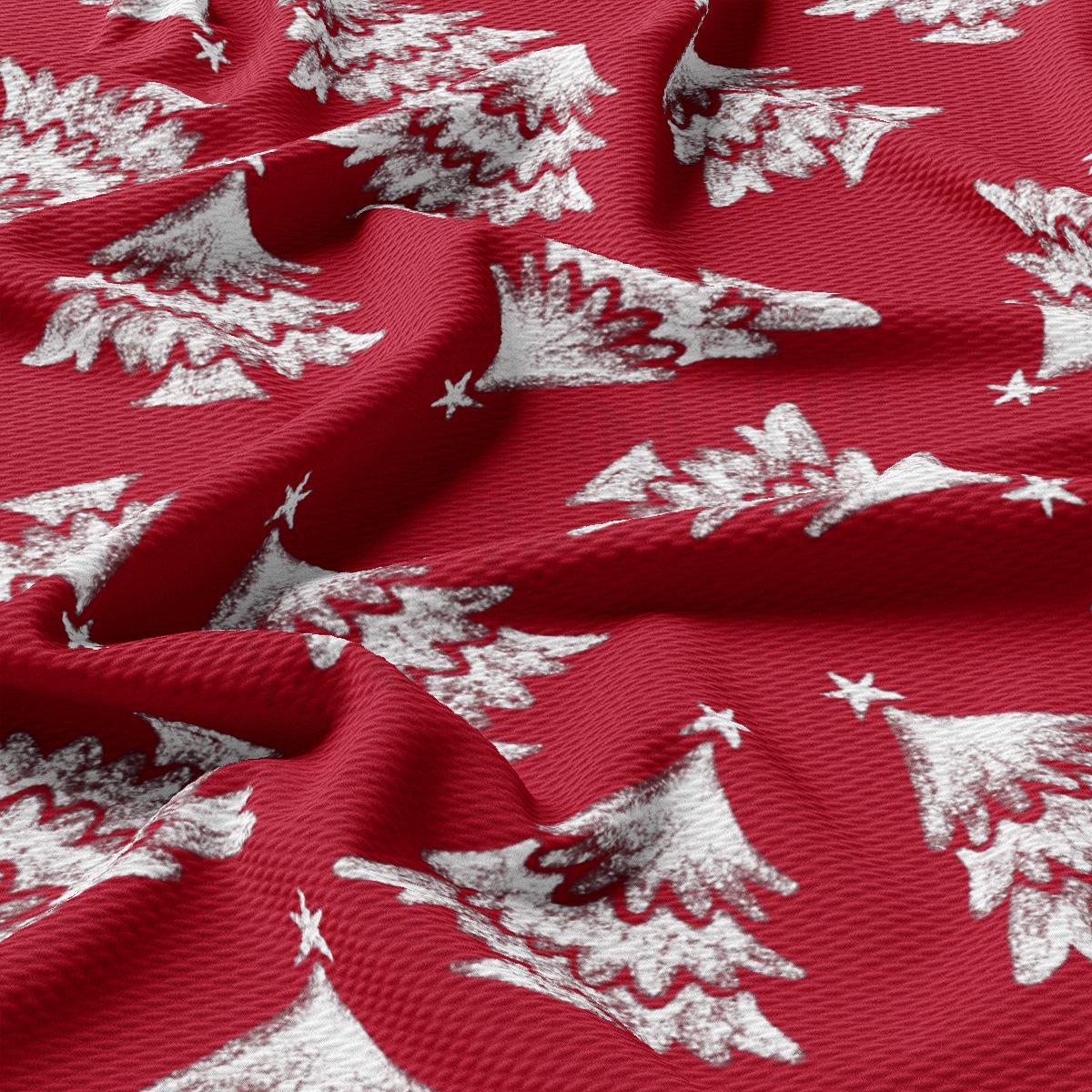 a red fabric with white snowflakes on it