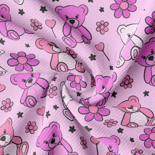 a pink and black teddy bear pattern on a pink background