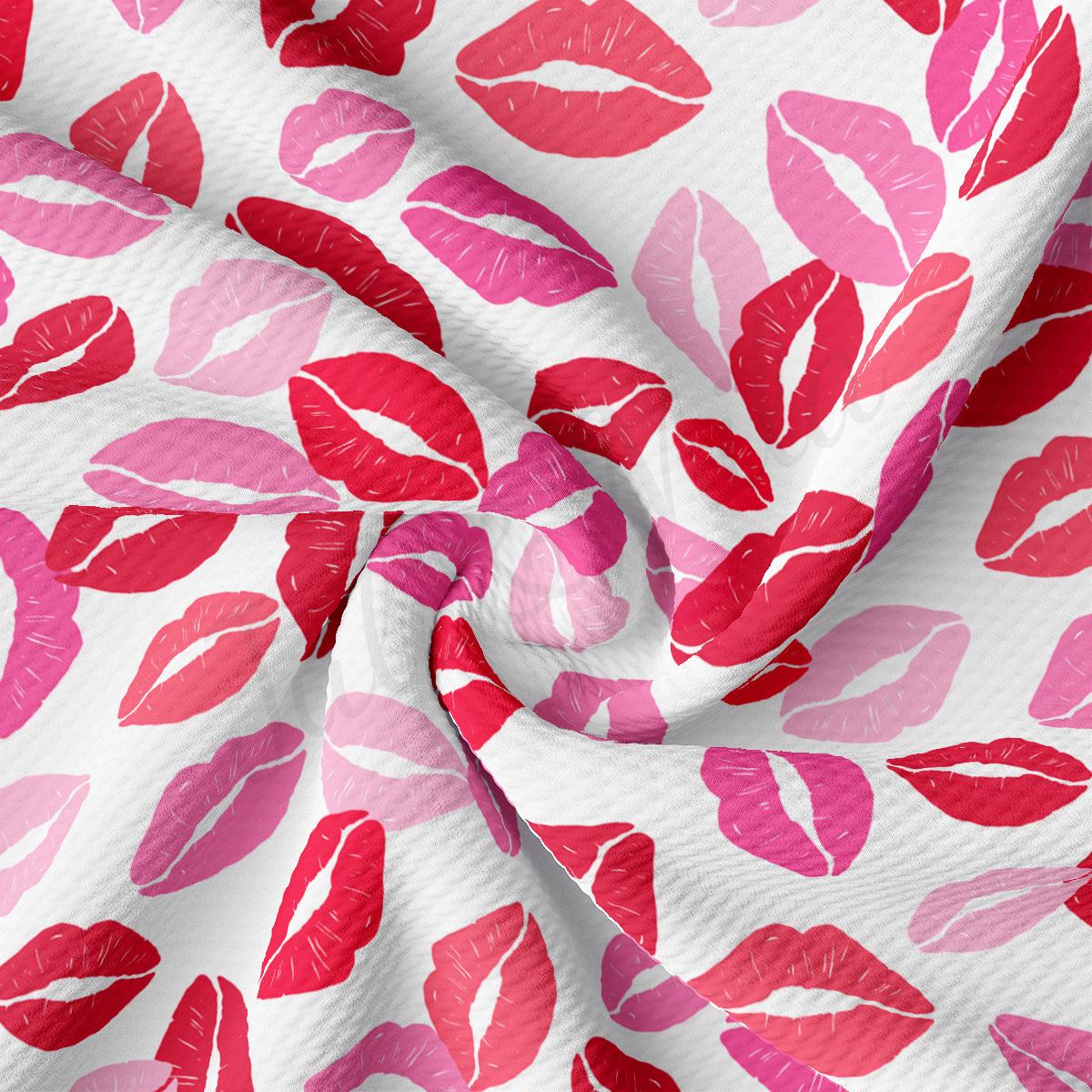 a close up of a pink and red lipstick print fabric