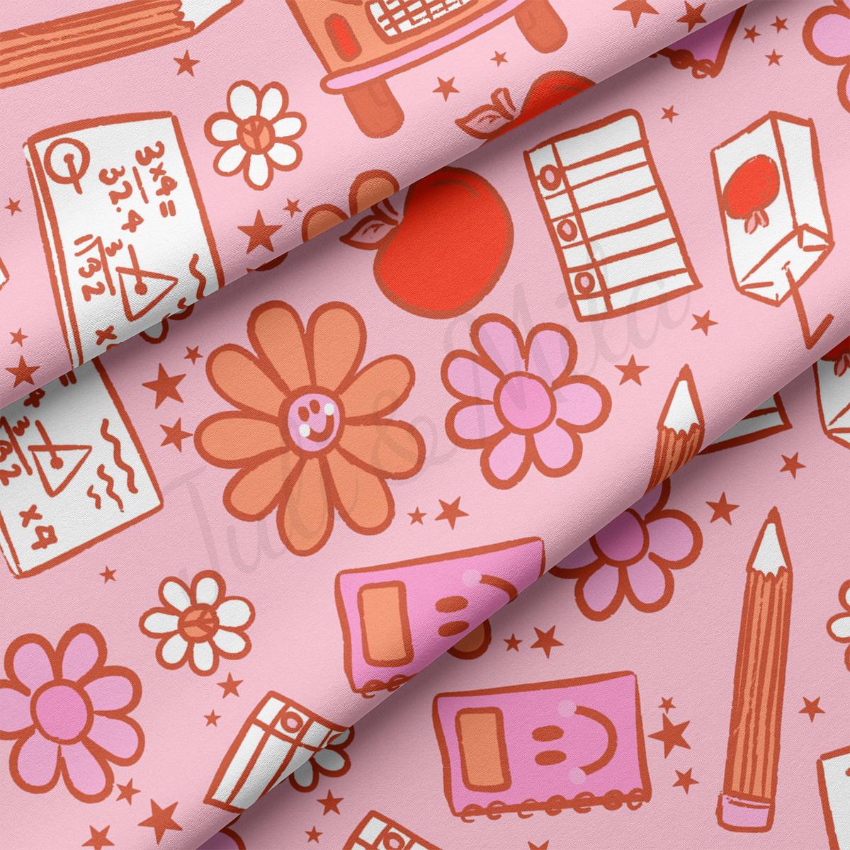 a close up of a pink background with a bunch of different things on it