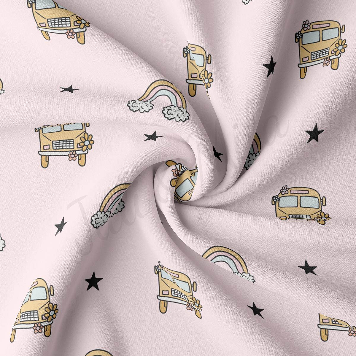 a pink background with a school bus and stars