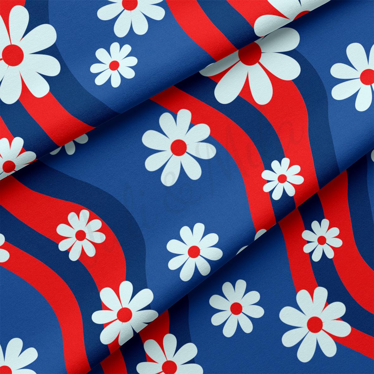 a red, white and blue flower pattern on a blue background