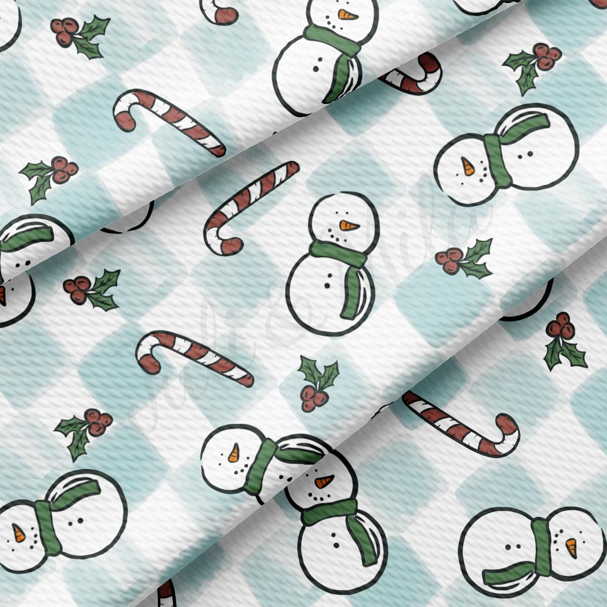 a pattern of snowmen and candy canes on a blue background