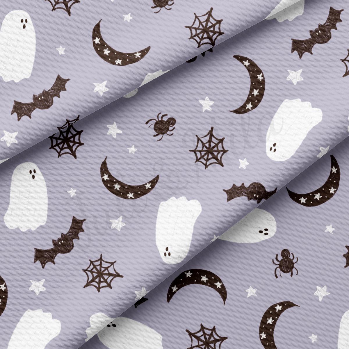 a pattern of ghost and stars on a purple background