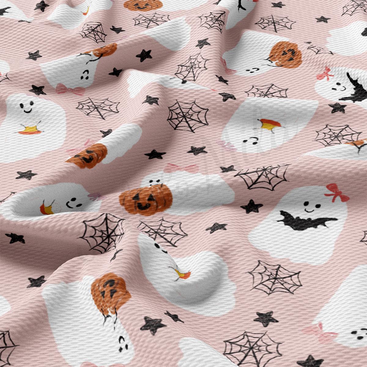 a pink background with a pattern of ghost and bats