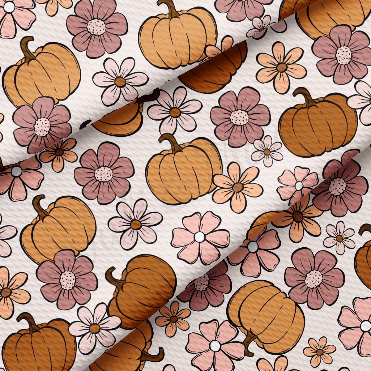 a pattern of pumpkins and flowers on a white background