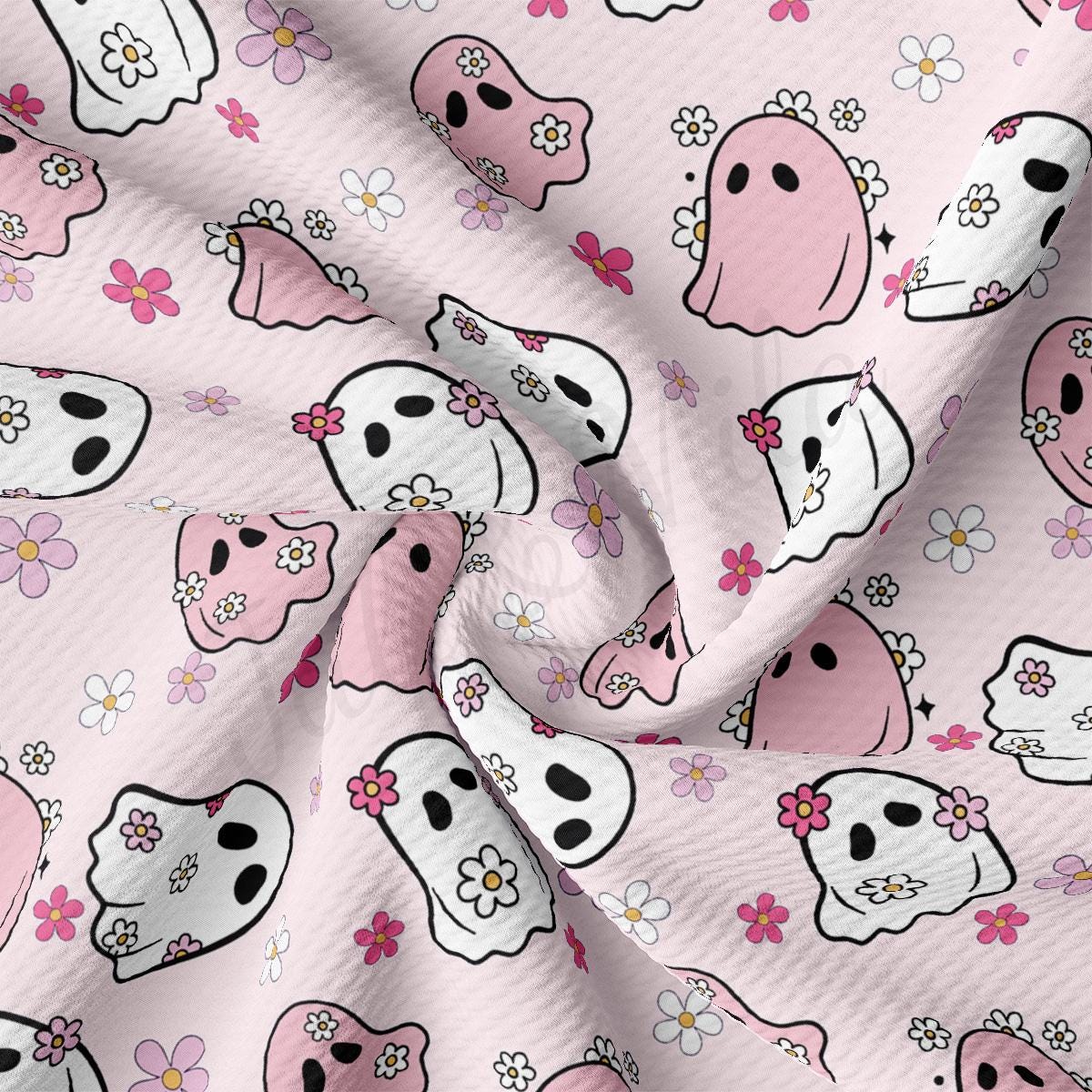 a pink background with skulls and flowers