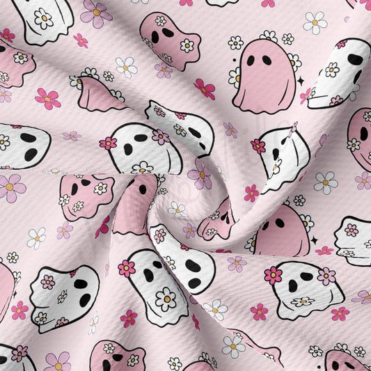 a pink background with skulls and flowers
