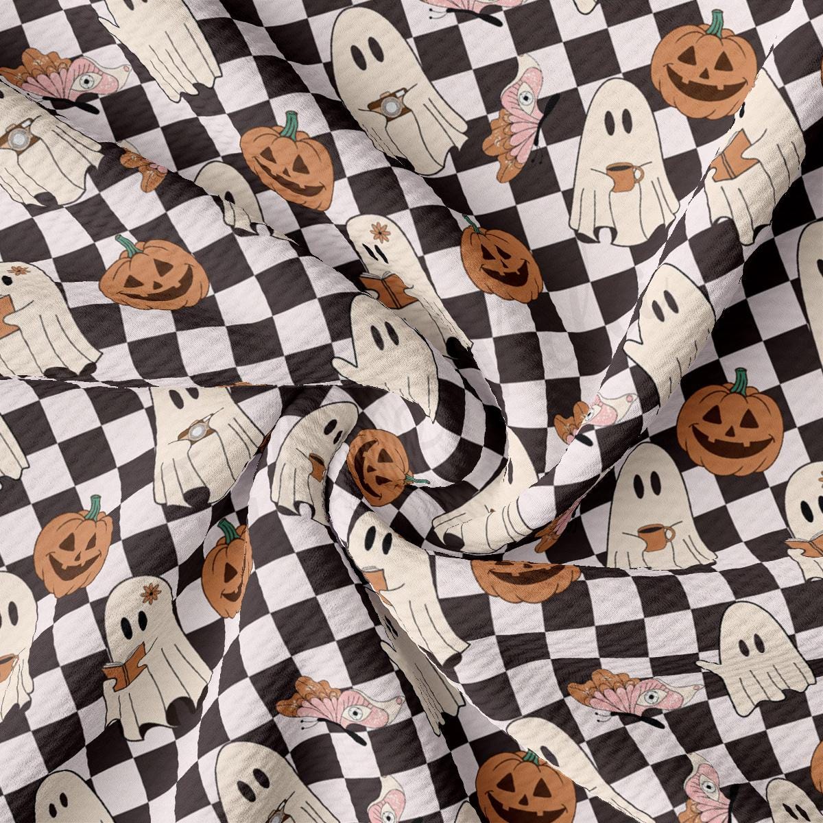 a black and white checkered fabric with pumpkins on it