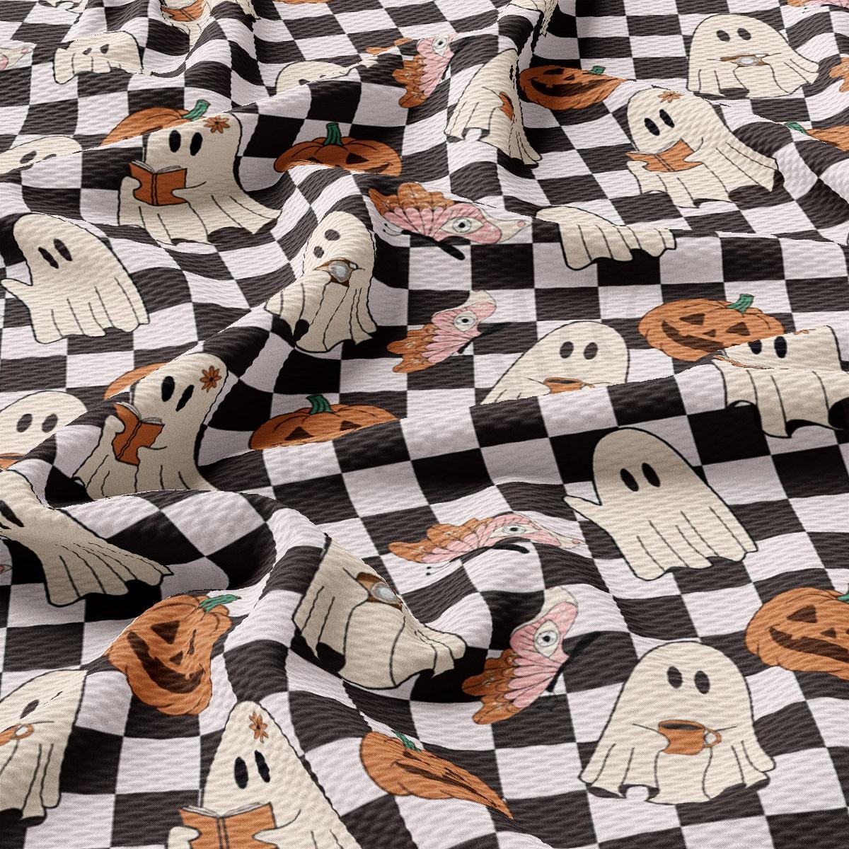 a black and white checkered fabric with ghost faces on it