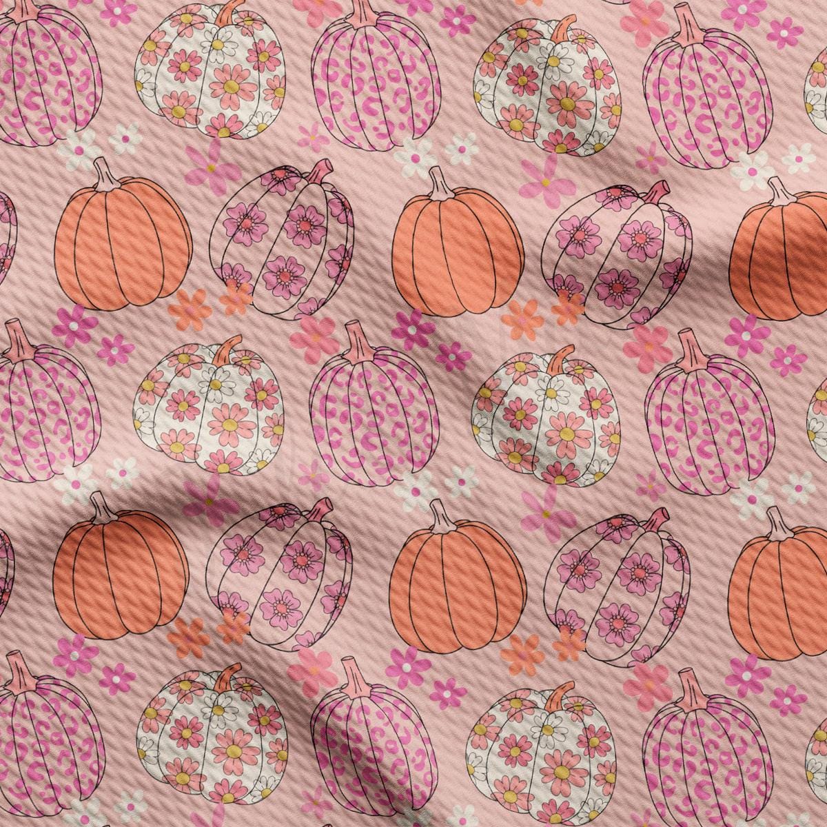 a pattern of pumpkins on a pink background