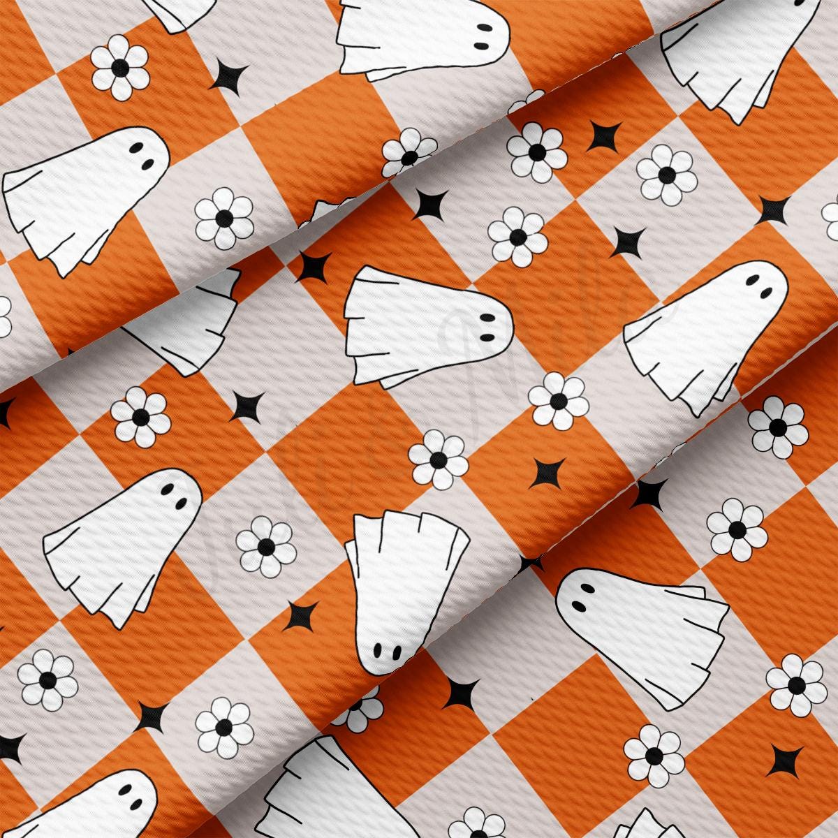 an orange and white checkered fabric with white dogs on it
