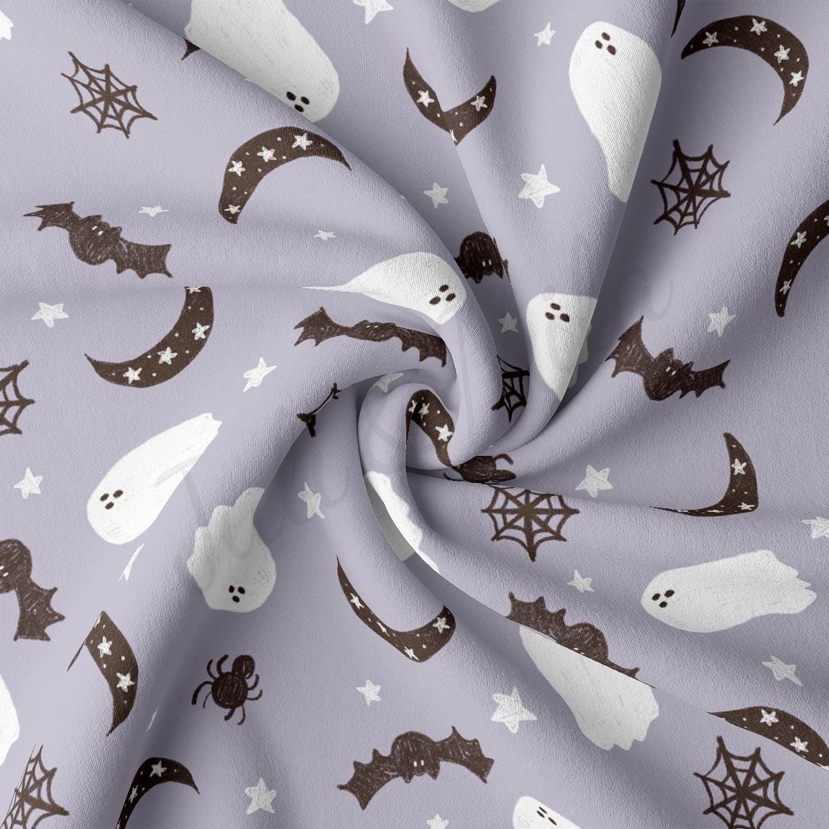 a close up of a purple fabric with ghost and bats on it