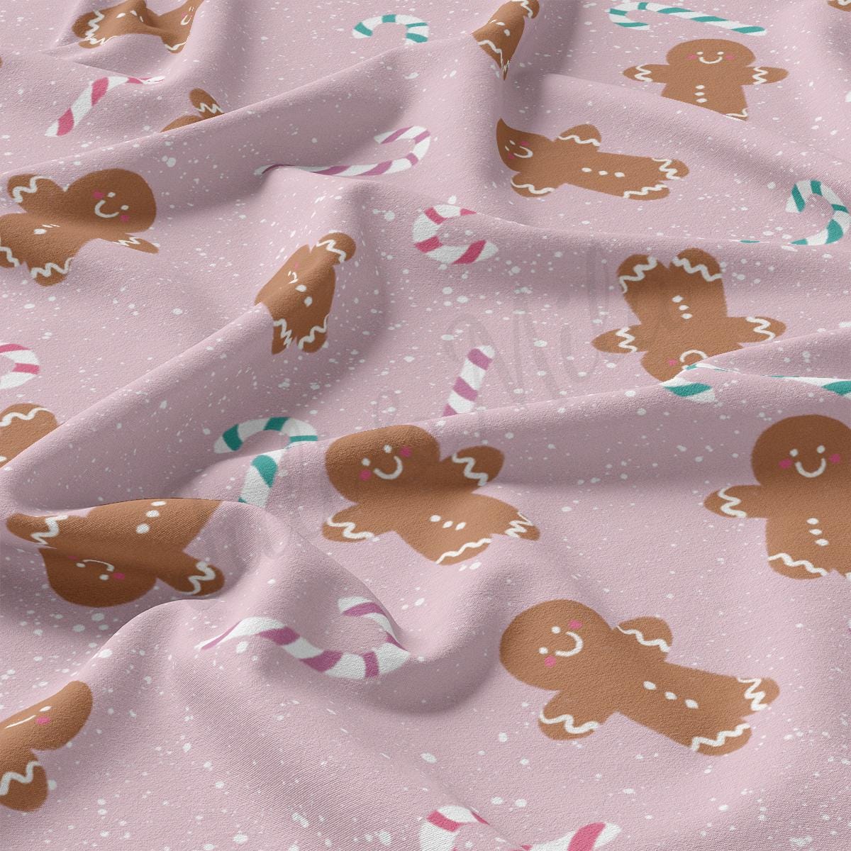 a close up of a pink fabric with gingerbreads on it