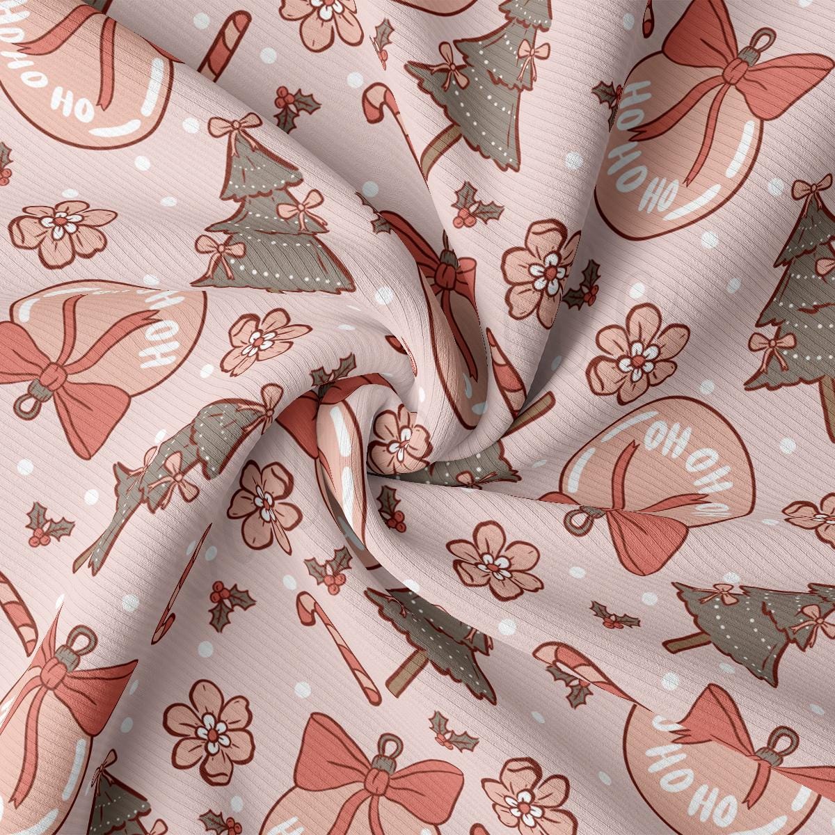 a close up of a pink fabric with christmas decorations on it