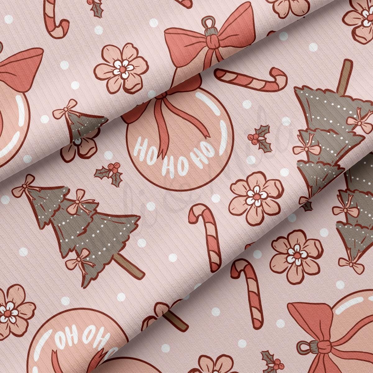 a pink background with christmas ornaments and candy canes