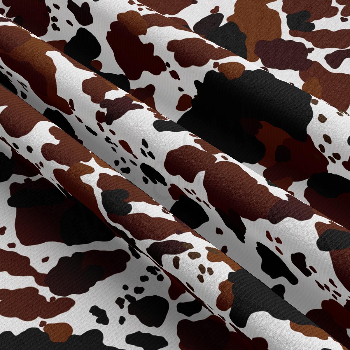 a pattern of brown and white spots on a white background