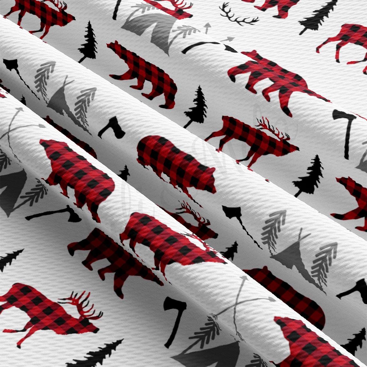 a pattern of red and black deer and trees on a white background