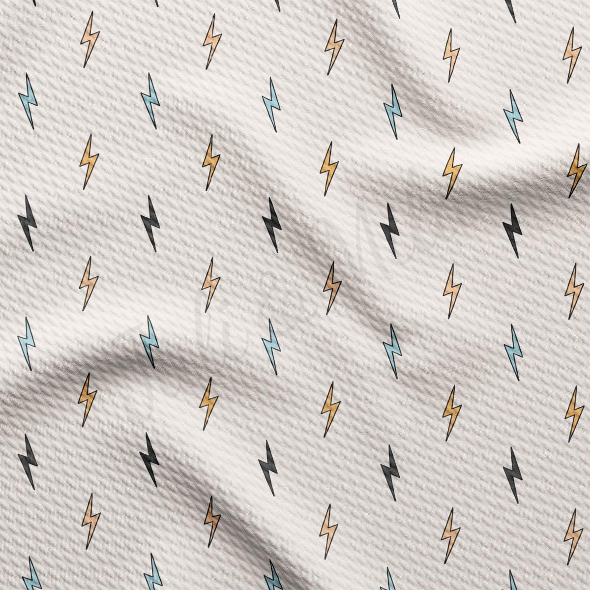 a white fabric with a pattern of lightning bolts