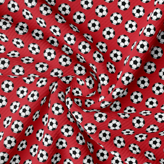 a red background with soccer balls on it