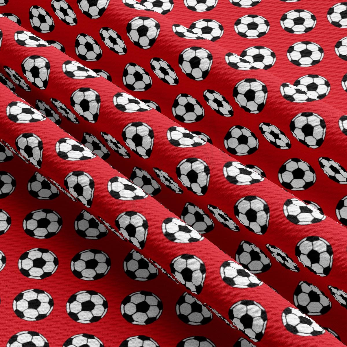 a red tie with soccer balls on it