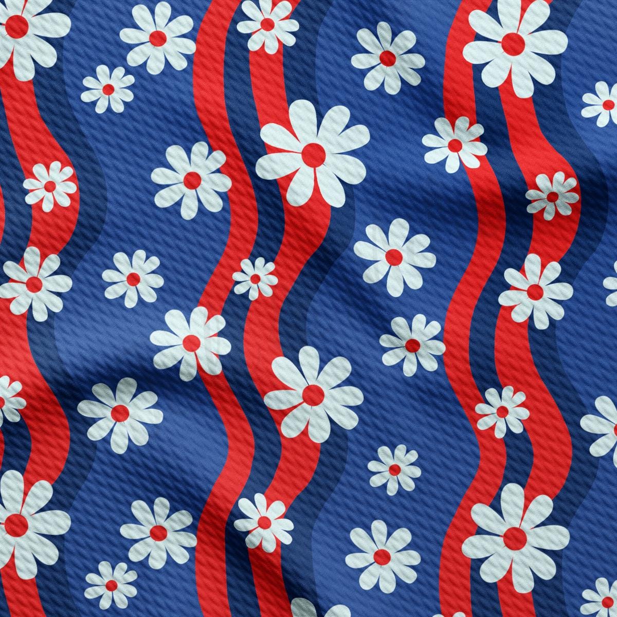 a red, white and blue flower pattern on a blue background