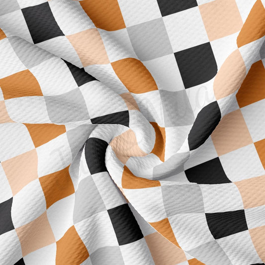 a checkered fabric with an orange and black design