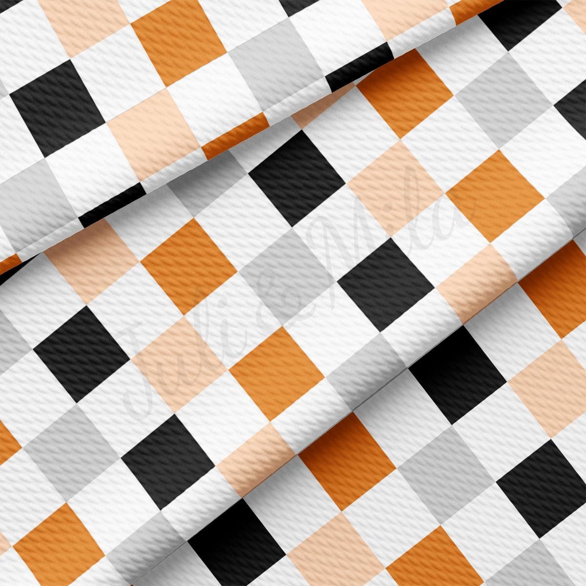 an orange and white checkered fabric with black and white squares