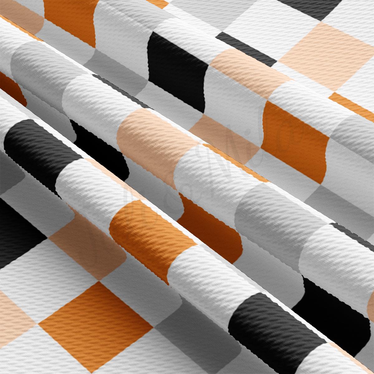 a group of orange and white checkered paper