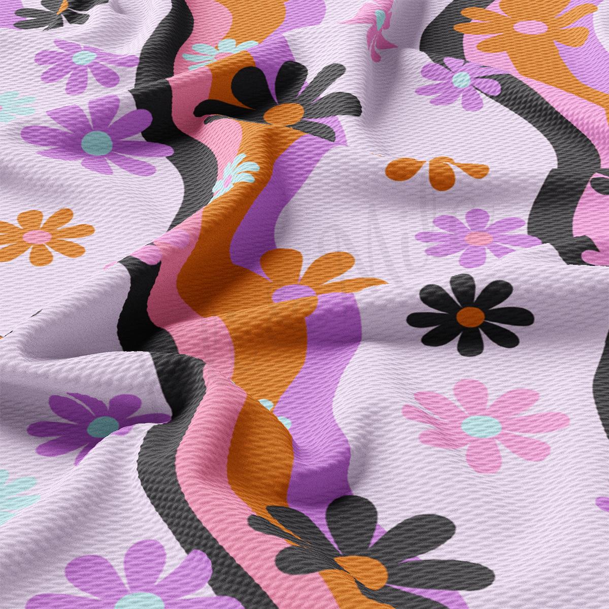 a close up of a pink and purple flowered fabric