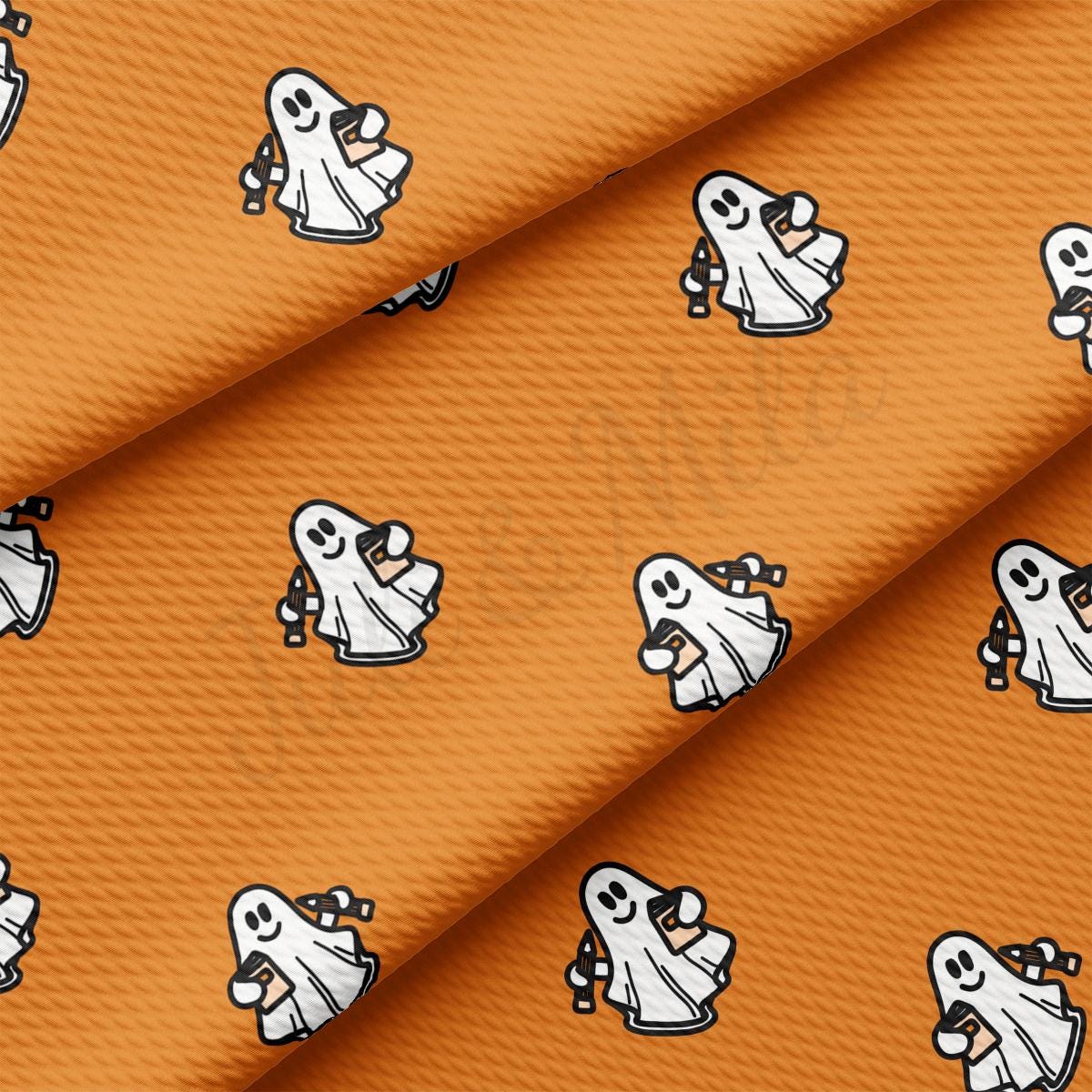 a close up of an orange fabric with a ghost pattern