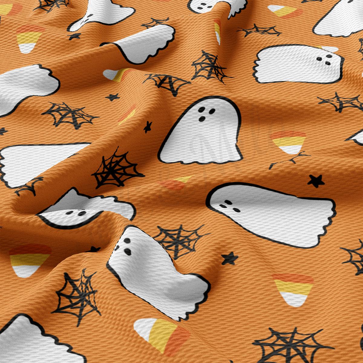 a close up of a pattern of ghost on an orange background