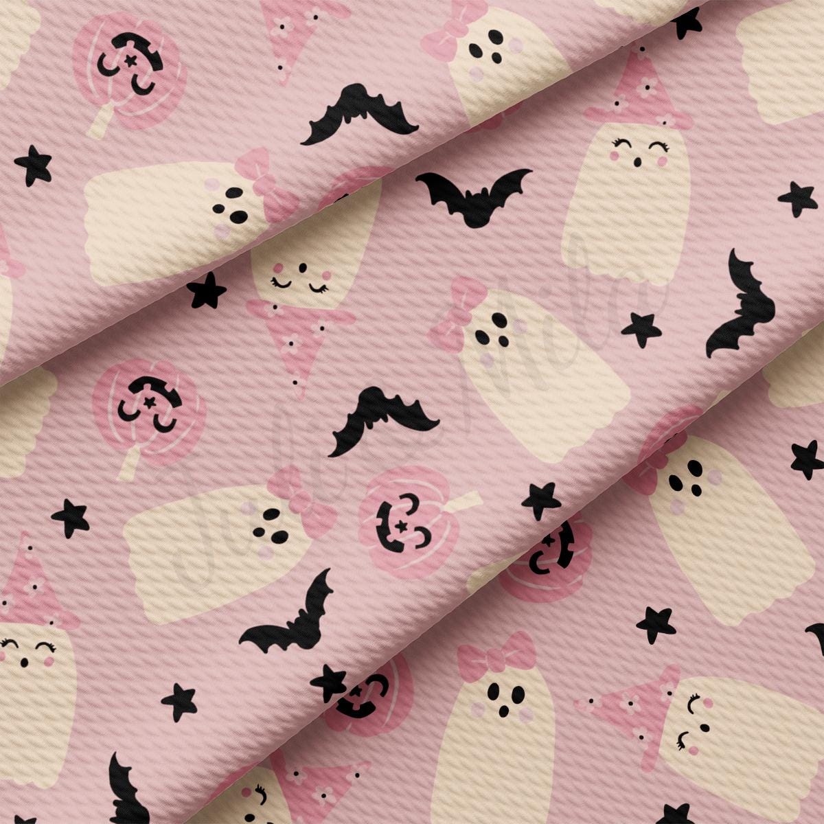 a pink background with black and white bats and stars