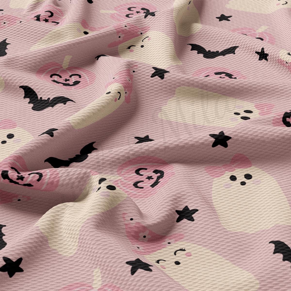 a pink background with black bats and skulls