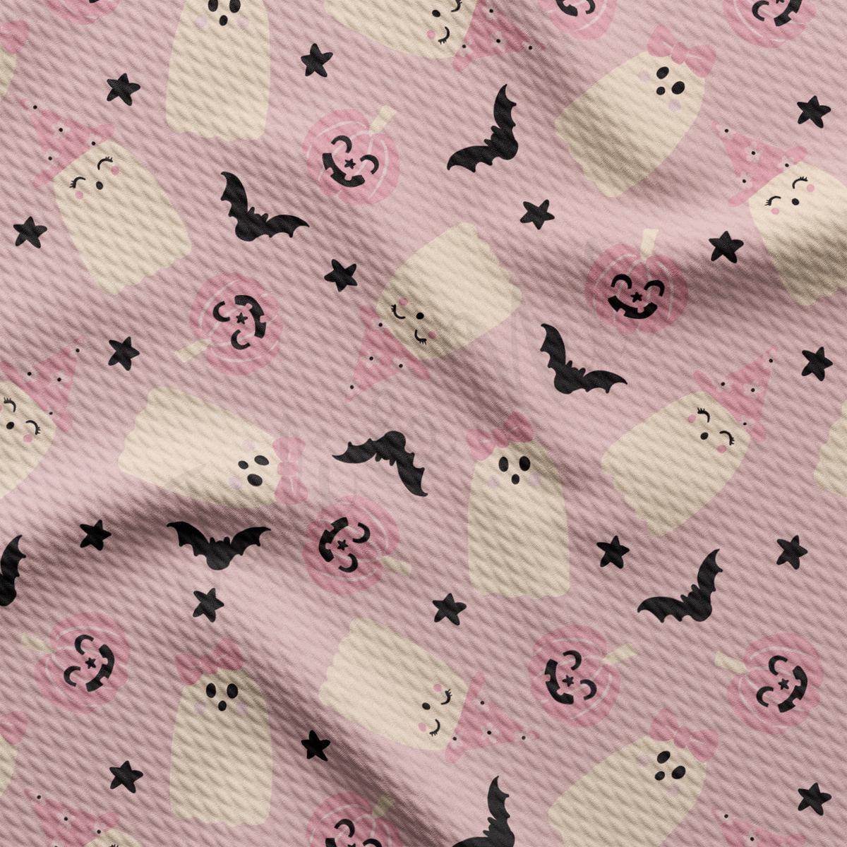 a pink background with black bats and skulls