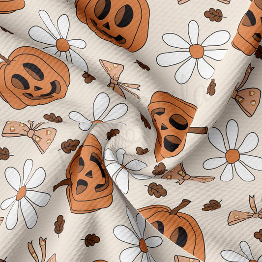 a pattern of pumpkins and flowers on a white background