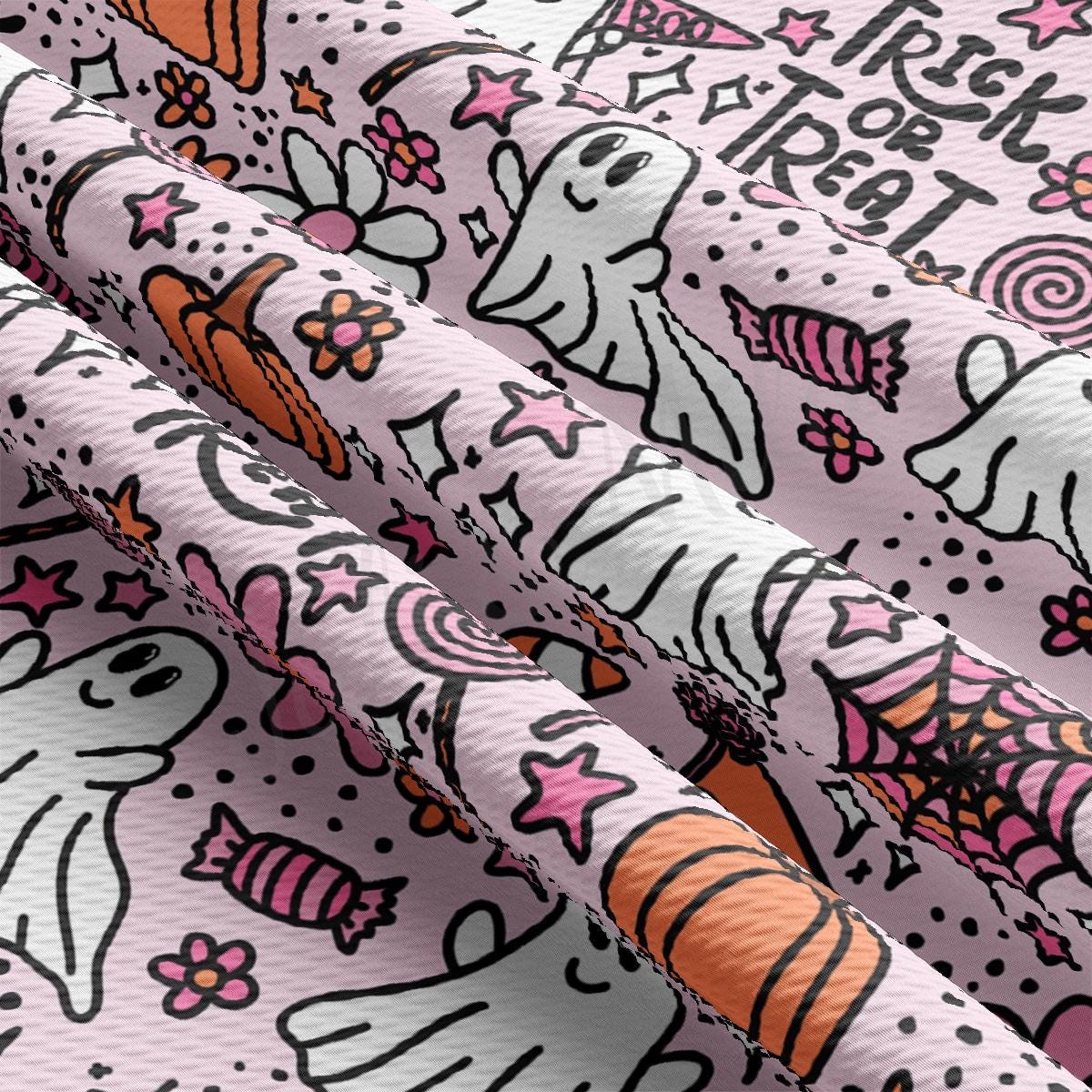 a close up of a pink fabric with unicorns on it