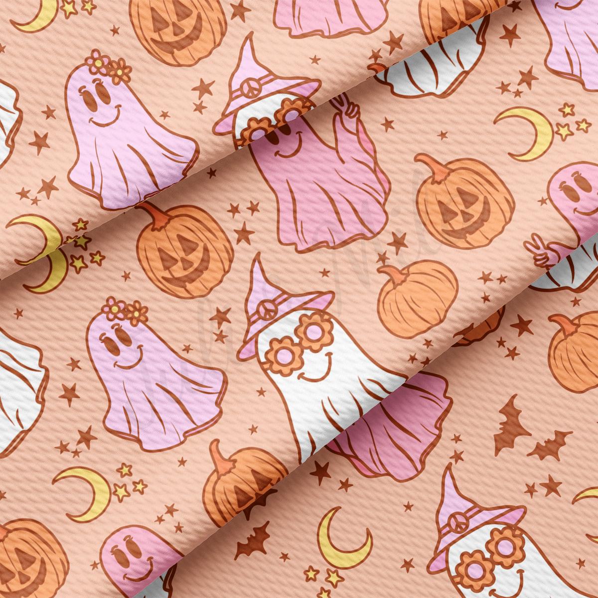 a pink and orange halloween pattern with pumpkins and ghostes