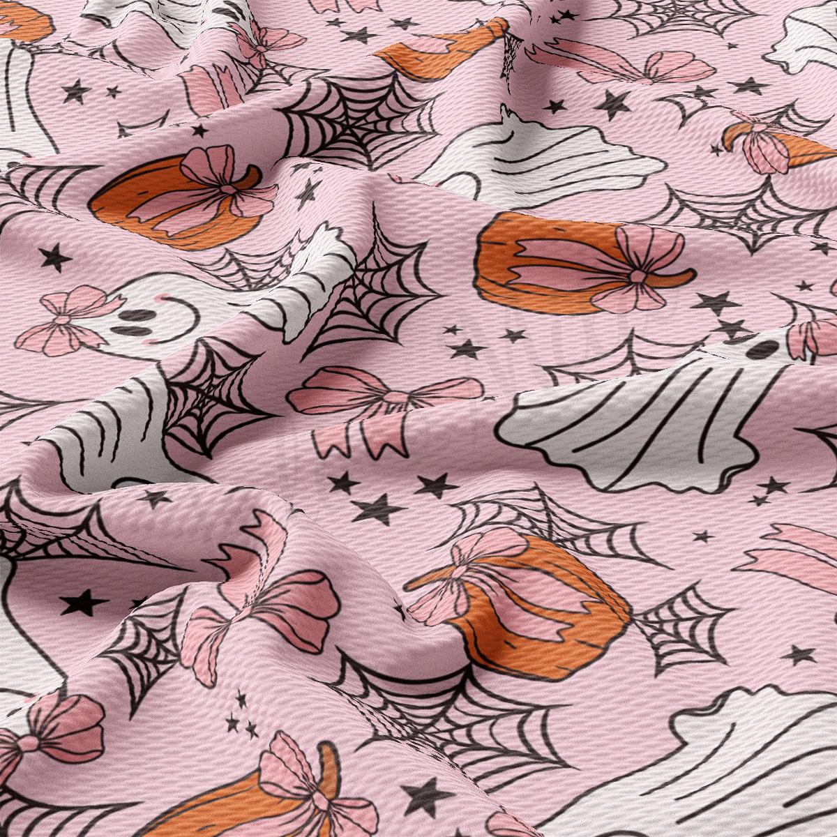 a close up of a pink background with spider webs