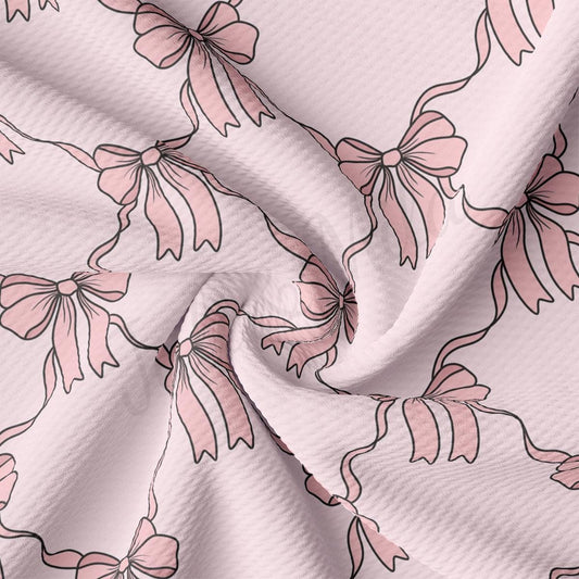 a close up of a pink flowered fabric