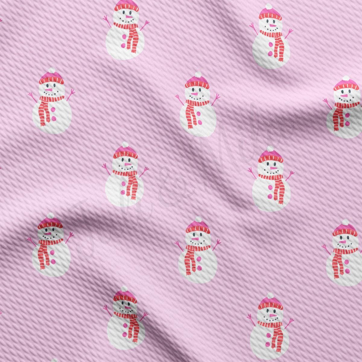 a pink fabric with a snowman pattern on it