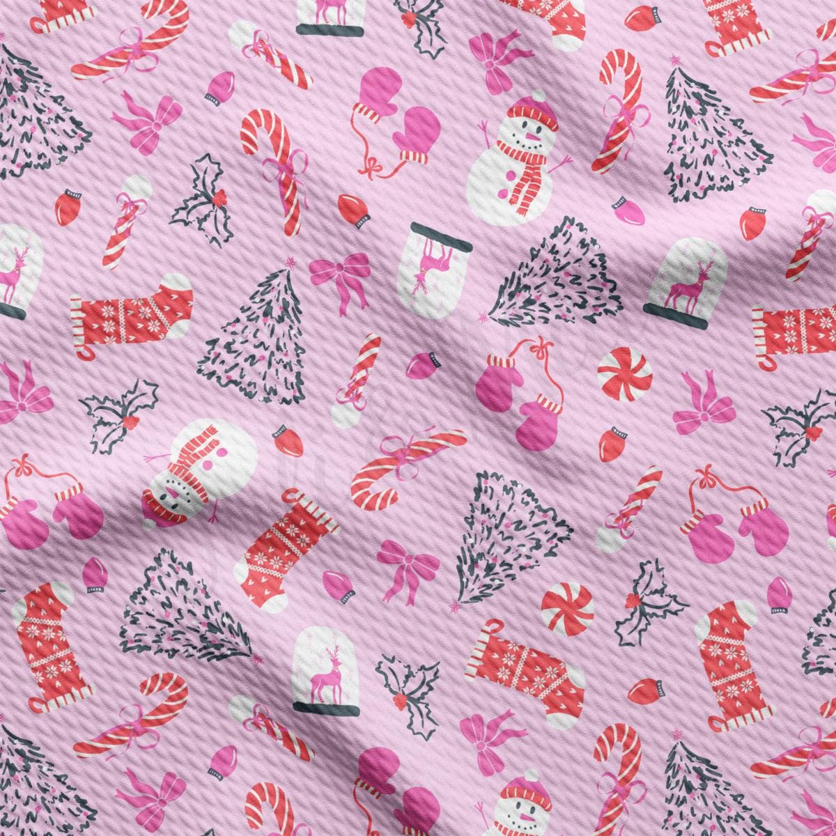 a pink fabric with a christmas pattern on it