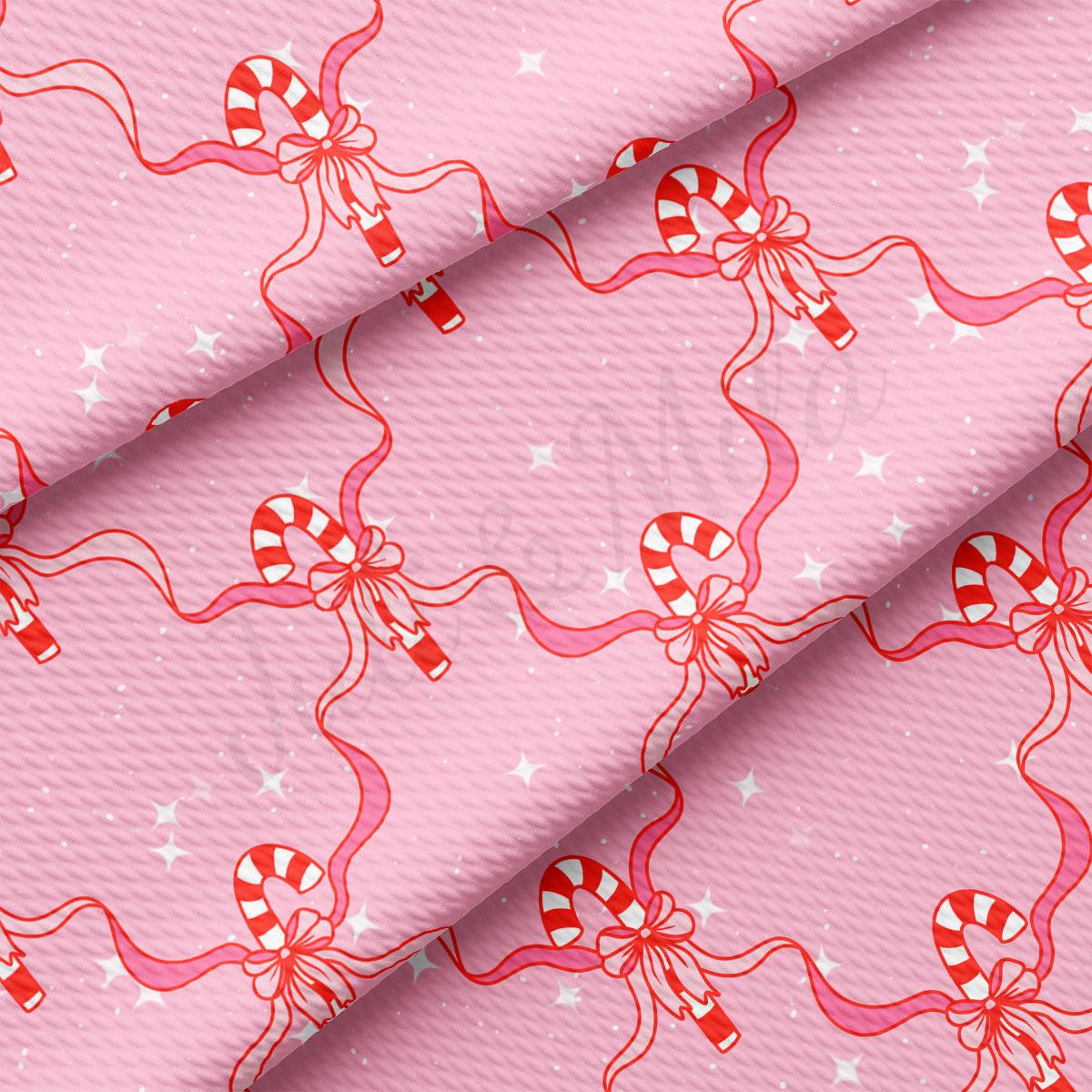 a pink background with candy canes and stars